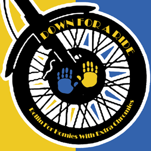 Graphic of a motorcycle tire with two hands, one blue and one yellow, and text on the tire that says Down for a Ride Rollin for Homies with extra Chromies